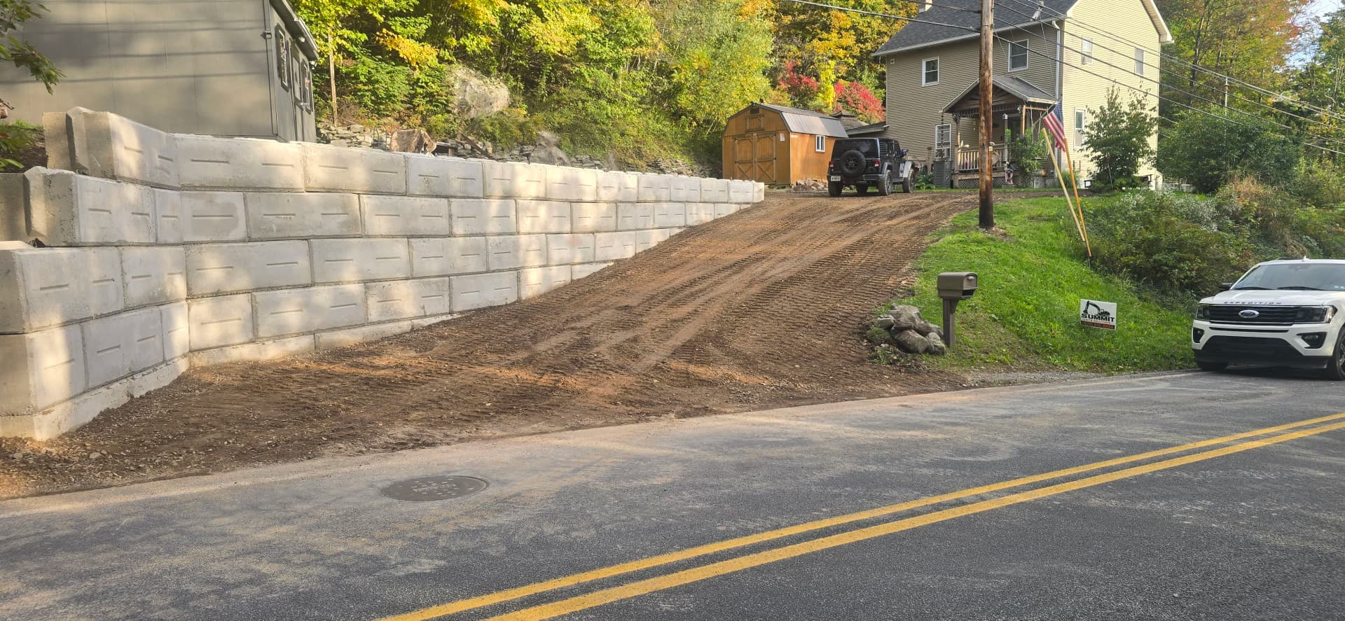 Failing Retaining Wall Replaced with Massive Concrete Block Wall in NEPA